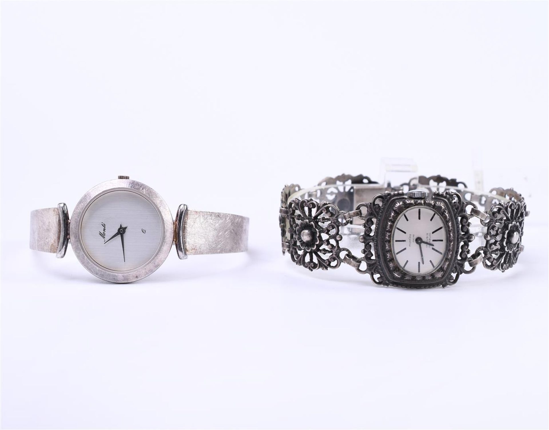 Silver ladies Montino watch (835) wind-up set with an elegant openwork strap