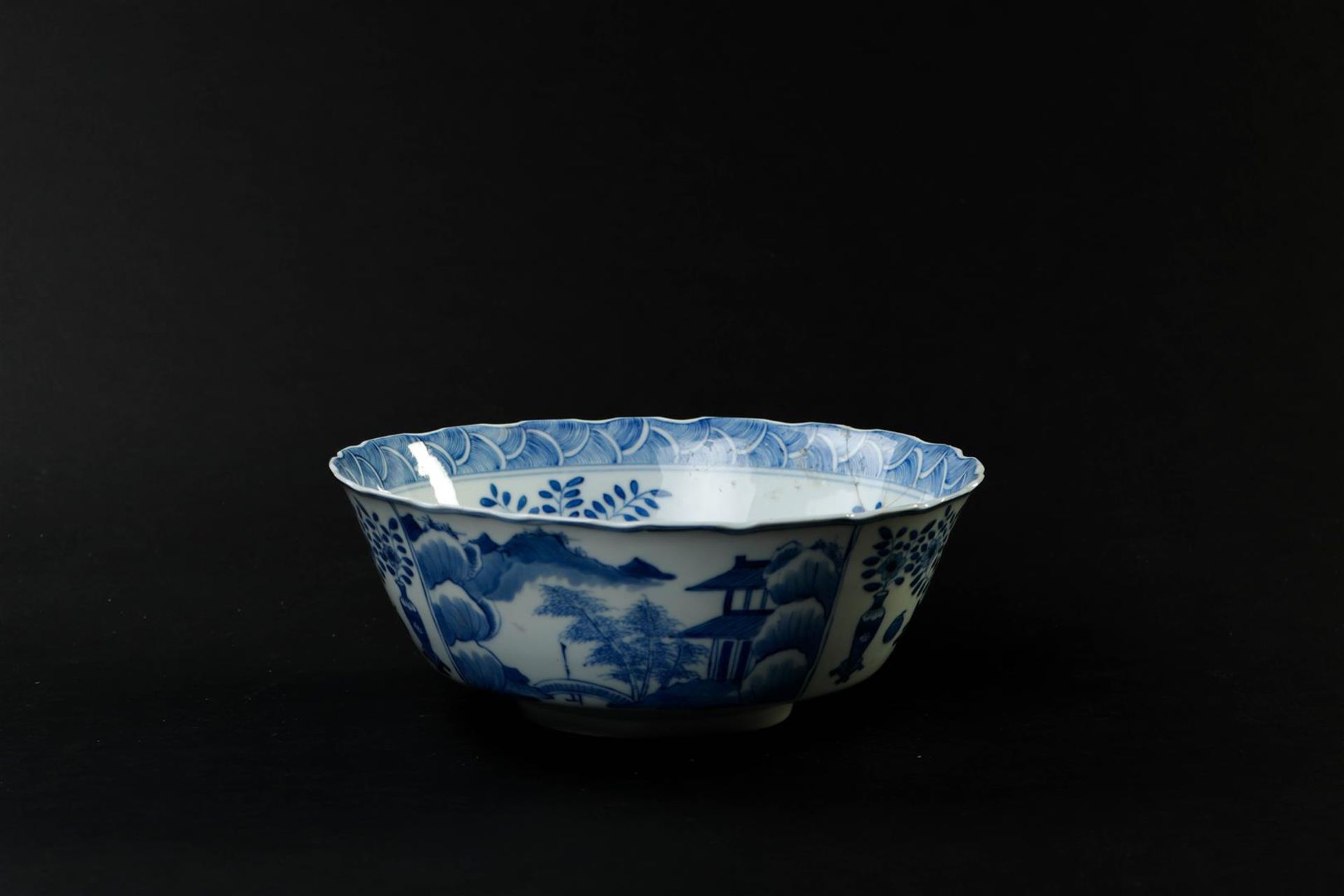 A large porcelain bowl decorated with landscapes and antiques, marked Kangxi. (glued). - Image 2 of 6