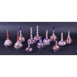 A lot of twelve Imari pipe vases. Japan, 19th century.
H. 11 - 17 cm.