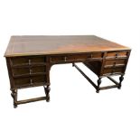 A partner desk with leather inlay. First half 20th century.