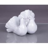 A porcelain figure of two turtle doves, marked Lladro.
Diam. 18 cm.