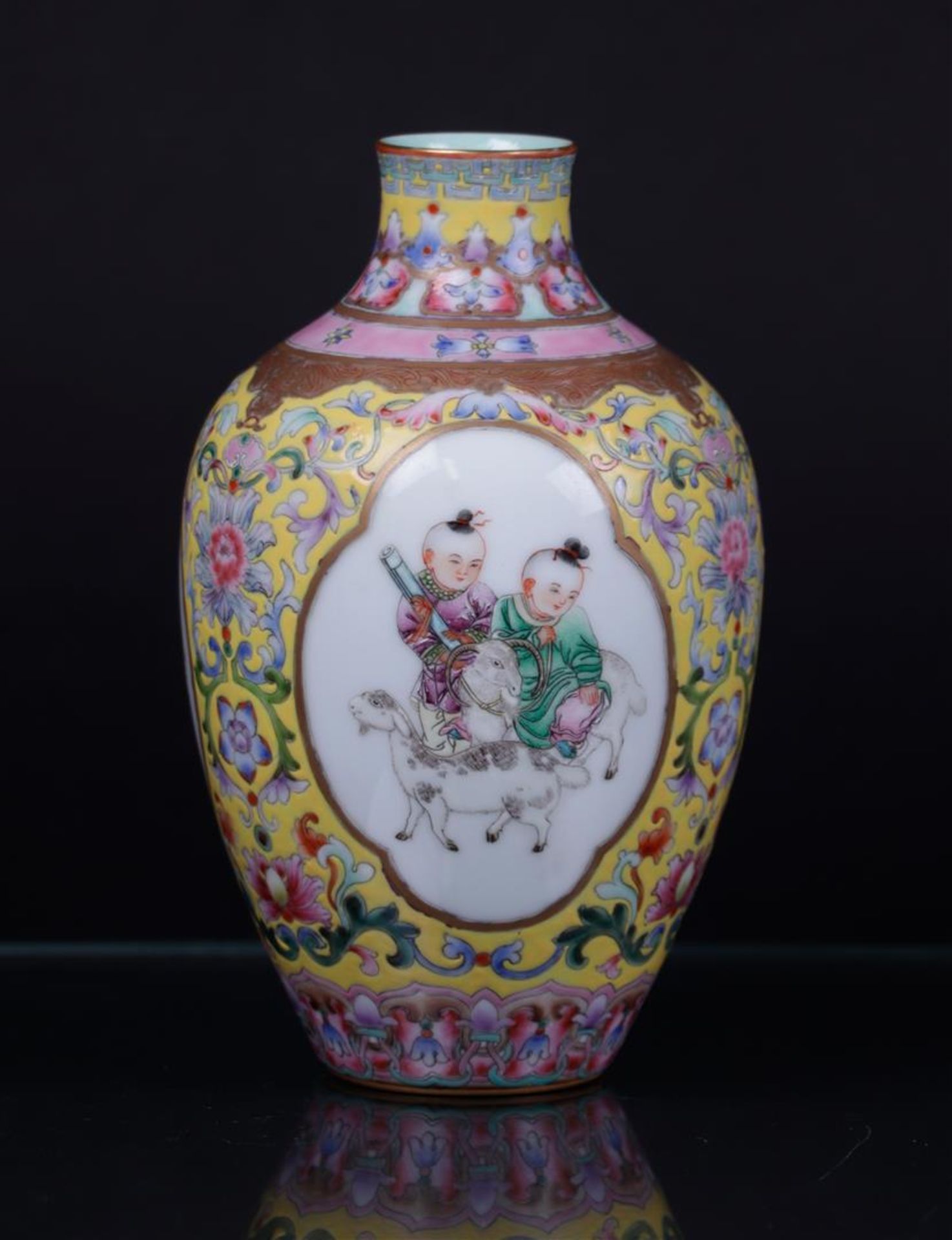 A porcelain famile rose vase decorated with figures in borders, marked Qianglong. China, republic.
H