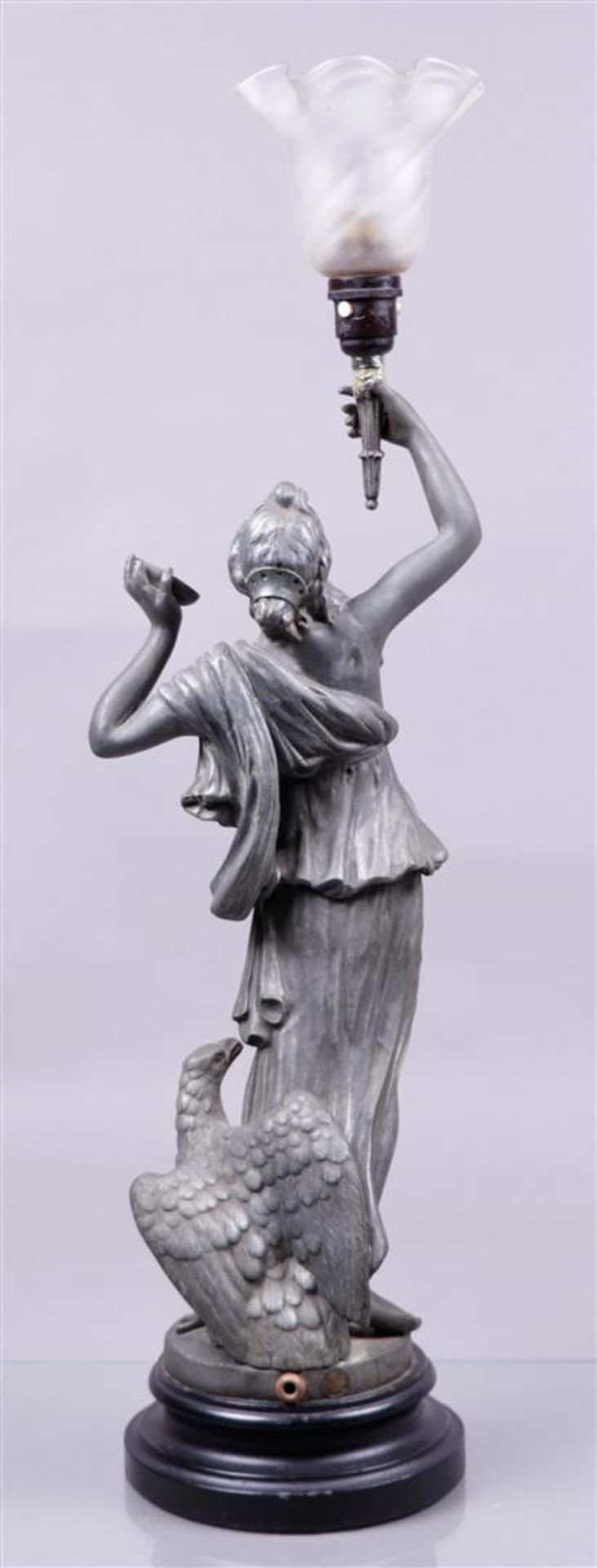 A cast metal statue of a woman holding a torch. (lamp). France, ca. 1900.
H.: 70 cm. - Image 2 of 2