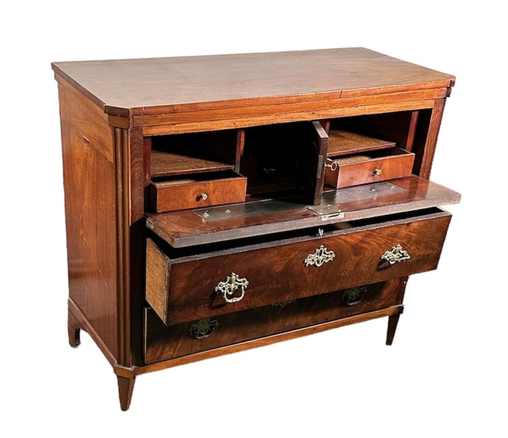 A mahogany three-drawer chest of drawers. The top drawer tilts and becomes a disc table. ca. 1780.
8