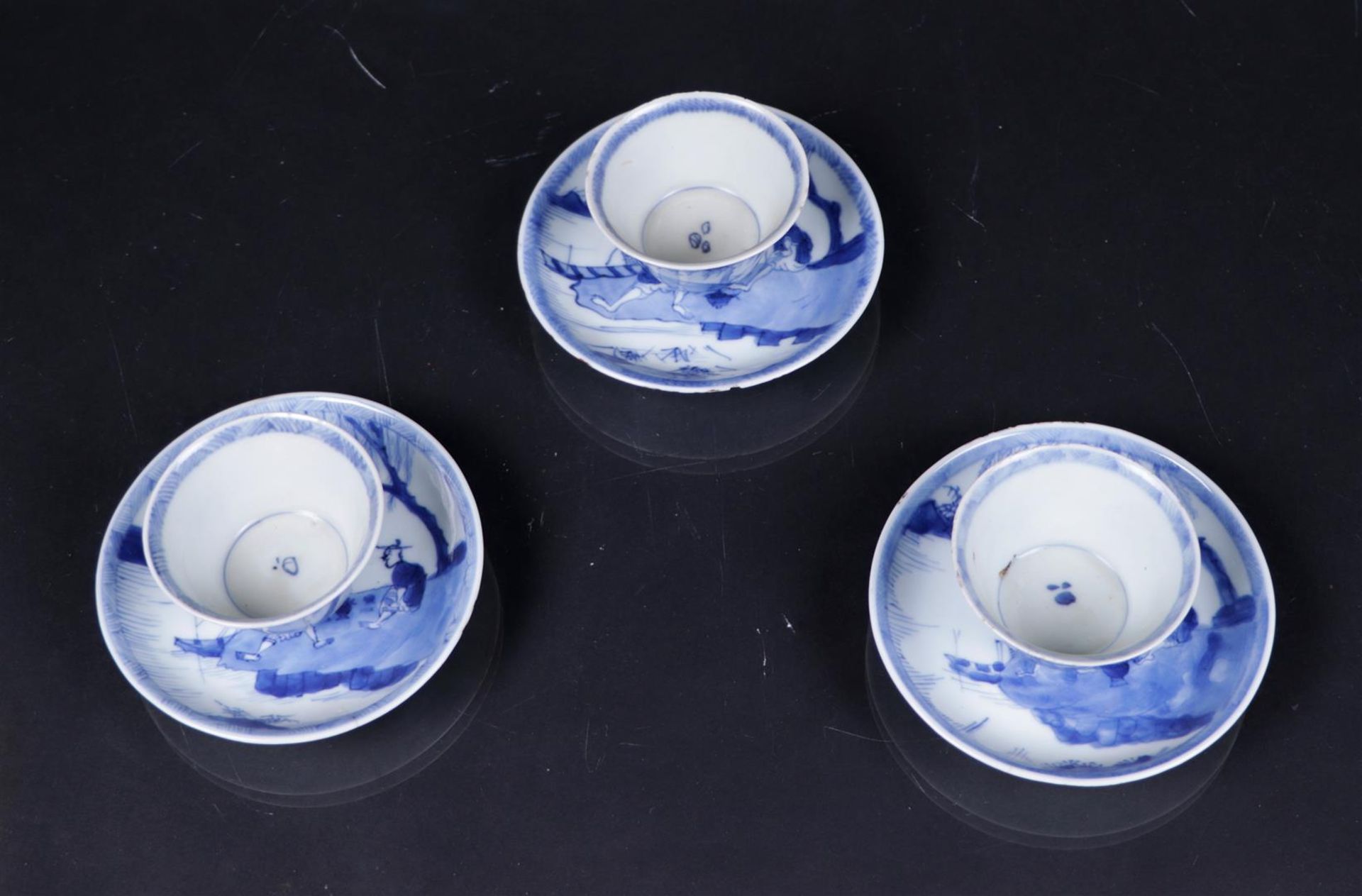 Three crazy cups and saucers in a landscape decor with a lotus border. China, Qianlong.
Diam. 10 cm. - Image 2 of 3