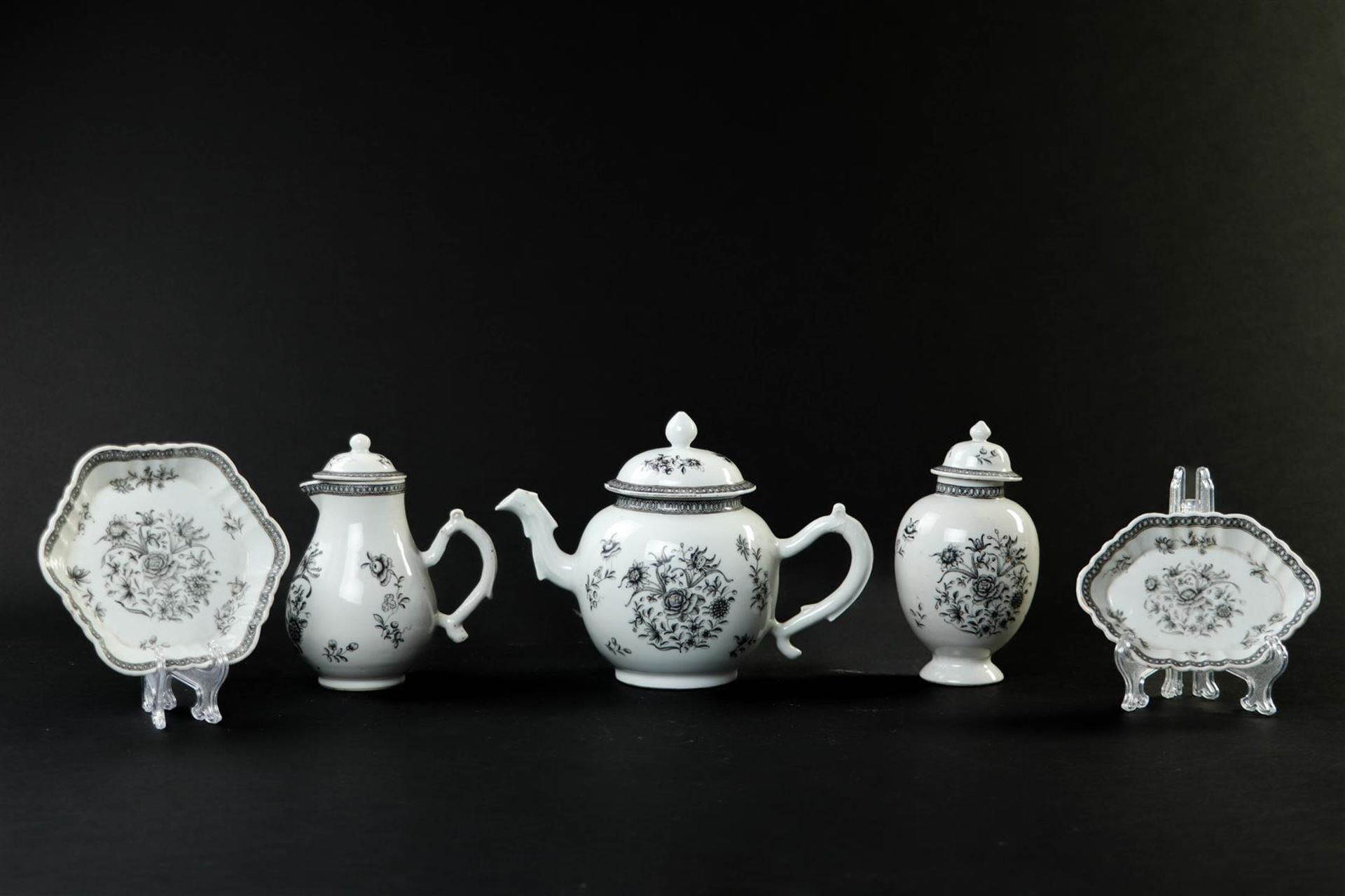 An Encre de Chine tableware set consisting of a teapot, milk jug, tea caddy, patty pan and spoon tra