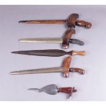 A lot consisting of (3) various kris and two blank weapons. Indonesia 19th century. or earlier.