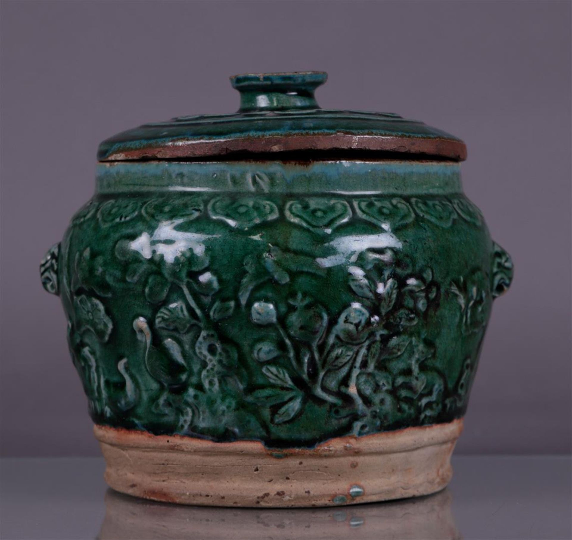 A green glazed lidded container. China, Ming?
Diam. 24 cm.