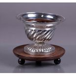 A silver pipe stove with copper inner container and mounted on wooden base, marked 'a' 1835. 341 gra