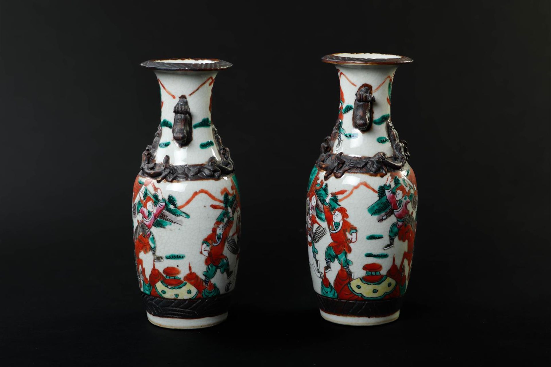 A pair of Nanking earthenware vases decorated with various figures. China, 19th century.
H. 25 cm. - Image 2 of 6