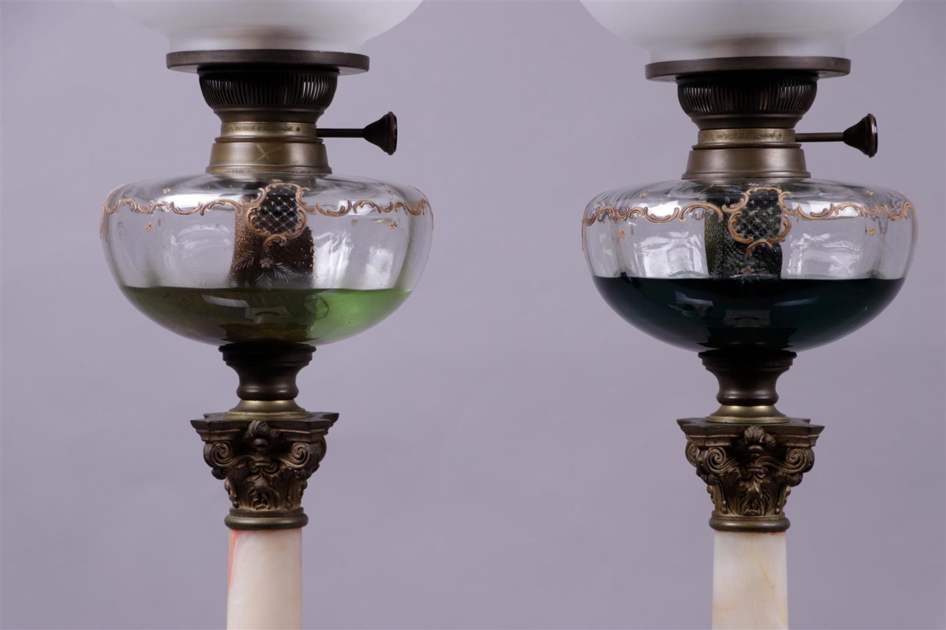 A pair of 19th century cold-painted oil lamps on white marble columns with Corinthian bronze capital - Image 2 of 2