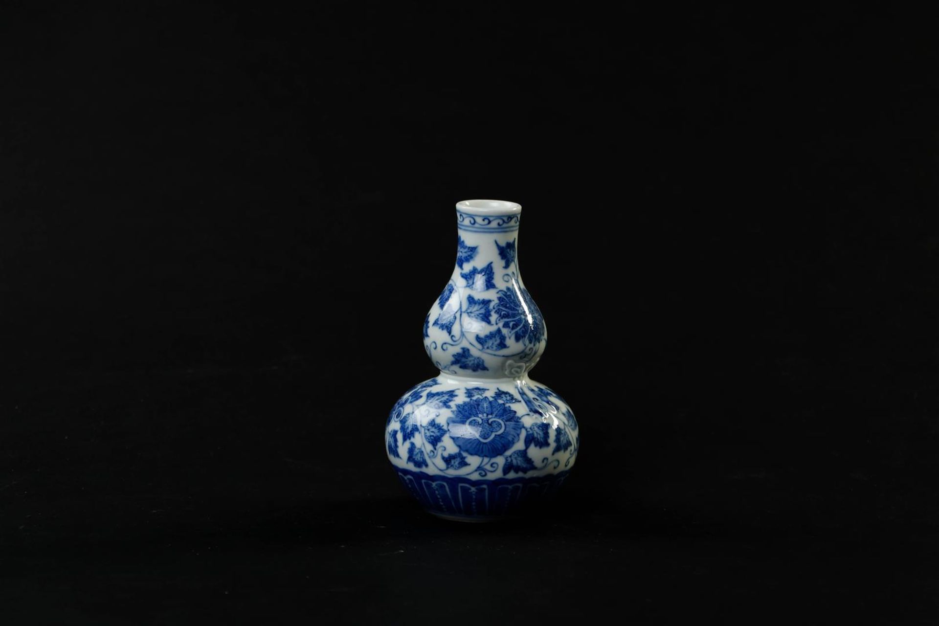 A porcelain gourd vase with a decor of branches and flowers, marked Guanxu. China, 19th century.
H.  - Image 3 of 6