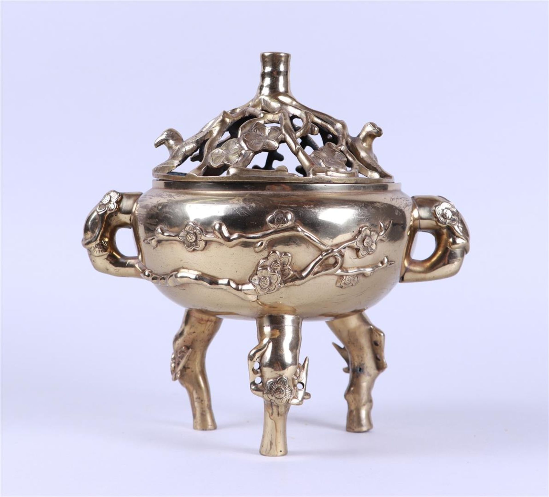 A bronze incense burner decorated with blossom branches, marked on the bottom. China, late 19th cent