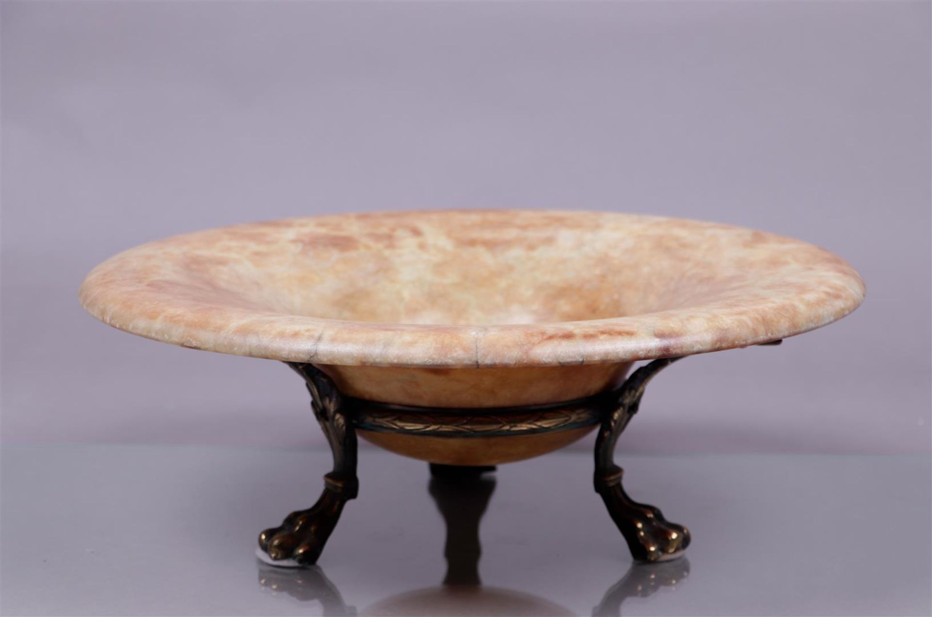 A Roman style marble bowl on a brass base. Italy.
Diam.: 42 cm.
