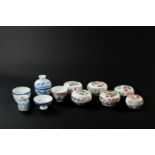 A lot of various lidded boxes and a cup. China, 19th century.