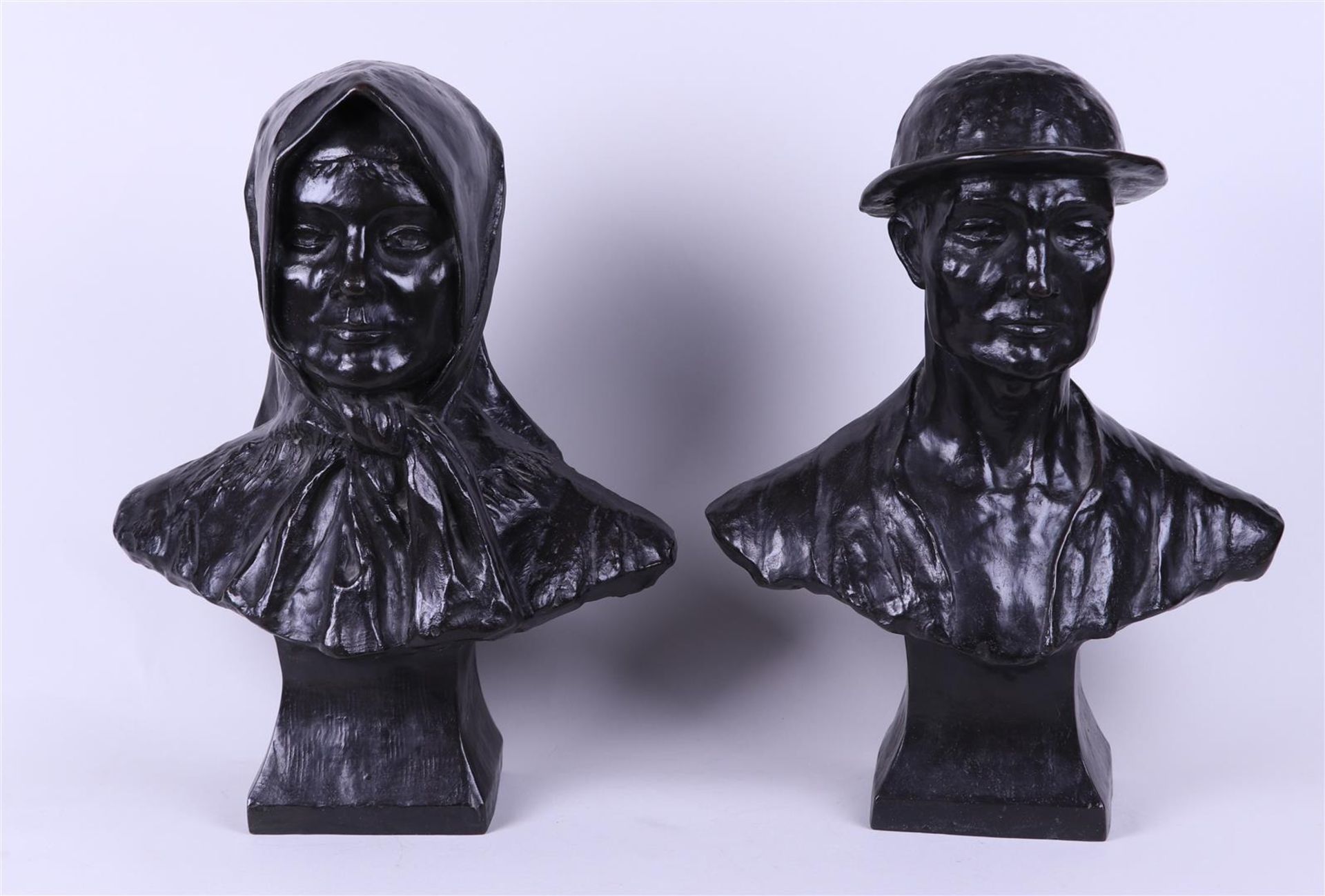 A set of (2) dark patinated bronze busts of a dome and his wife. Belgium, first half of the 20th cen