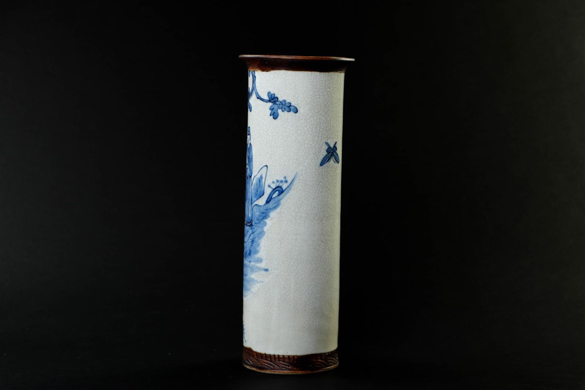 A Nanking cylinder vase decorated with various figures.
H. 35 cm. - Image 3 of 5