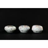 A lot of three porcelain lidded boxes decorated with, among other things, Qilin's and figures. China