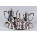 A four-piece coffee/tea set with curved model; Coffee pot, teapot, milk jug and sugar bowl all with 