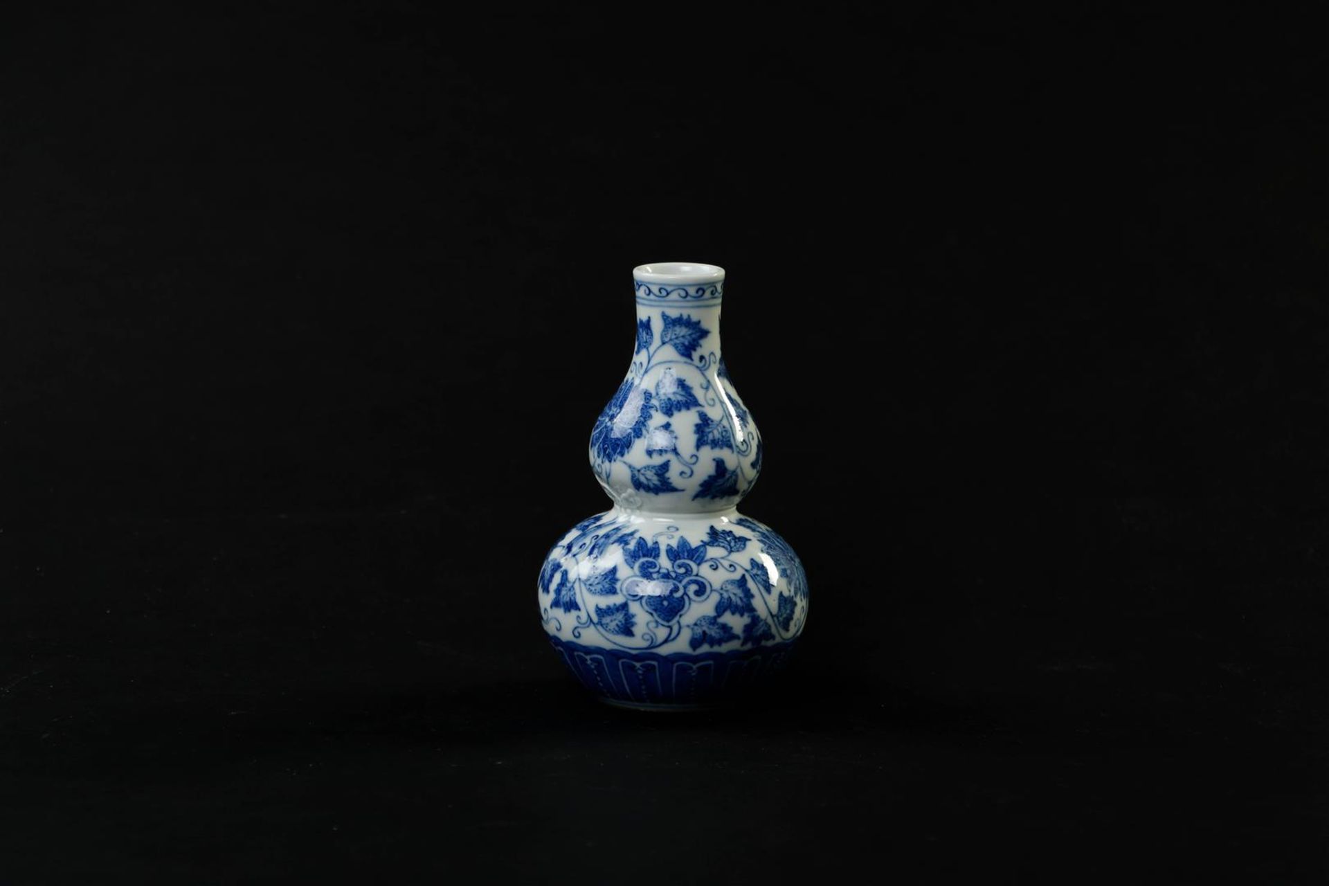 A porcelain gourd vase with a decor of branches and flowers, marked Guanxu. China, 19th century.
H.  - Image 4 of 6