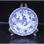 A porcelain saucer with two long frames in the center with a fence decor. China, 18th century
Diam. 
