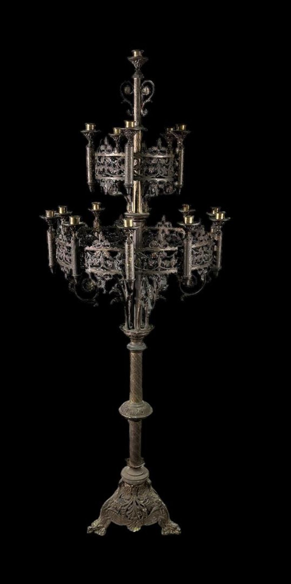 A large wrought iron church candlestick.