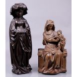 A lot consisting of (2) plaster statues. Resp. a seated madonna with child after an early Gothic exa