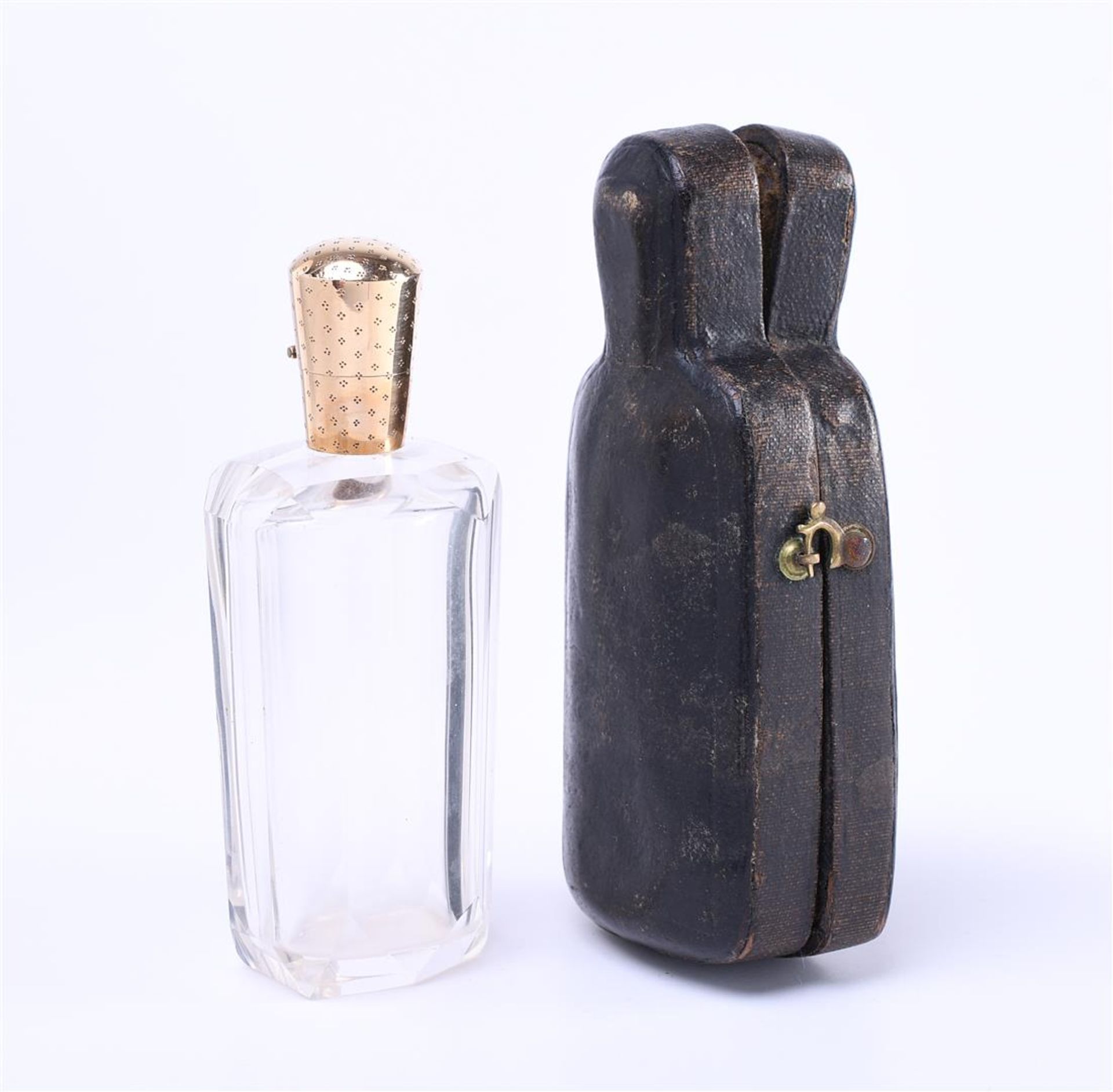 14 kt. Perfume bottle with travel case. Perfume bottle is made of glass and 14kt gold cap. Travel ca