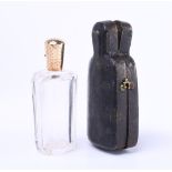 14 kt. Perfume bottle with travel case. Perfume bottle is made of glass and 14kt gold cap. Travel ca
