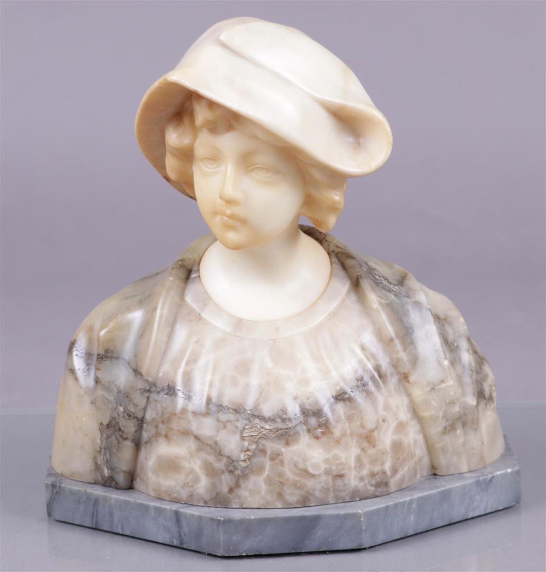 A marble bust of an Italian beauty, made of various types of marble. Italy ca. 1900.
H.: 27 cm.