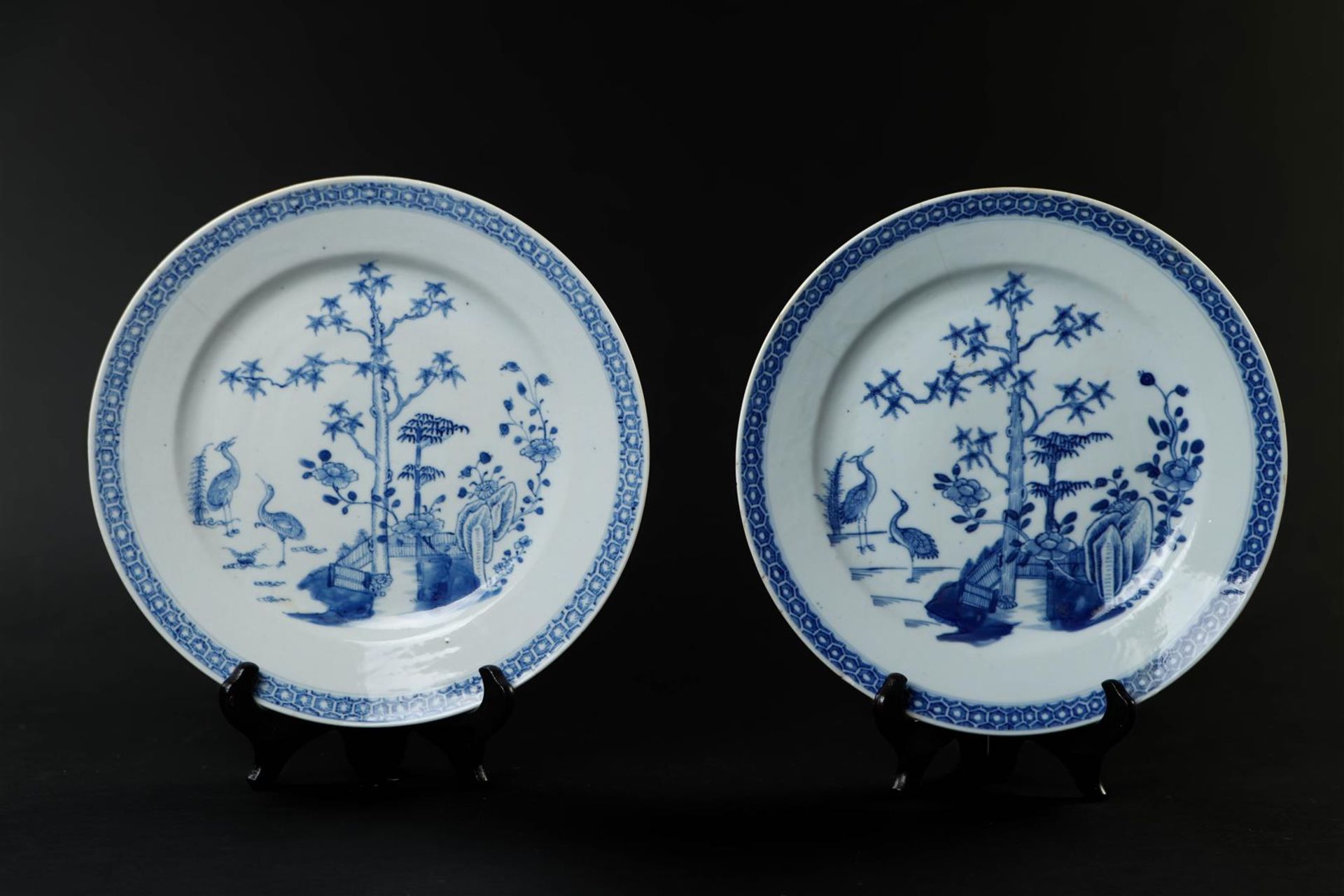 Two porcelain plates with cranes near a river with the three friends of winter, pine tree, prunus, b