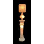 An alabaster floor lamp consisting of separate parts. The top can be used separately as a table lamp