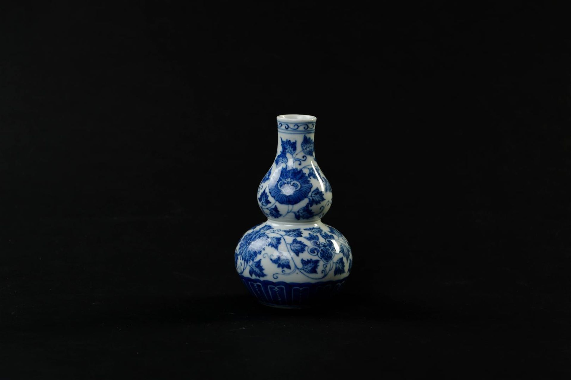 A porcelain gourd vase with a decor of branches and flowers, marked Guanxu. China, 19th century.
H.  - Image 2 of 6