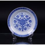 A porcelain plate decorated with, among other things, Swastika characters, marked Chenghua.
Diam. 16