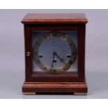 A Warmink table clock with chimes in a mahogany case. 20th century.
22,5 x 18 x 15 cm.