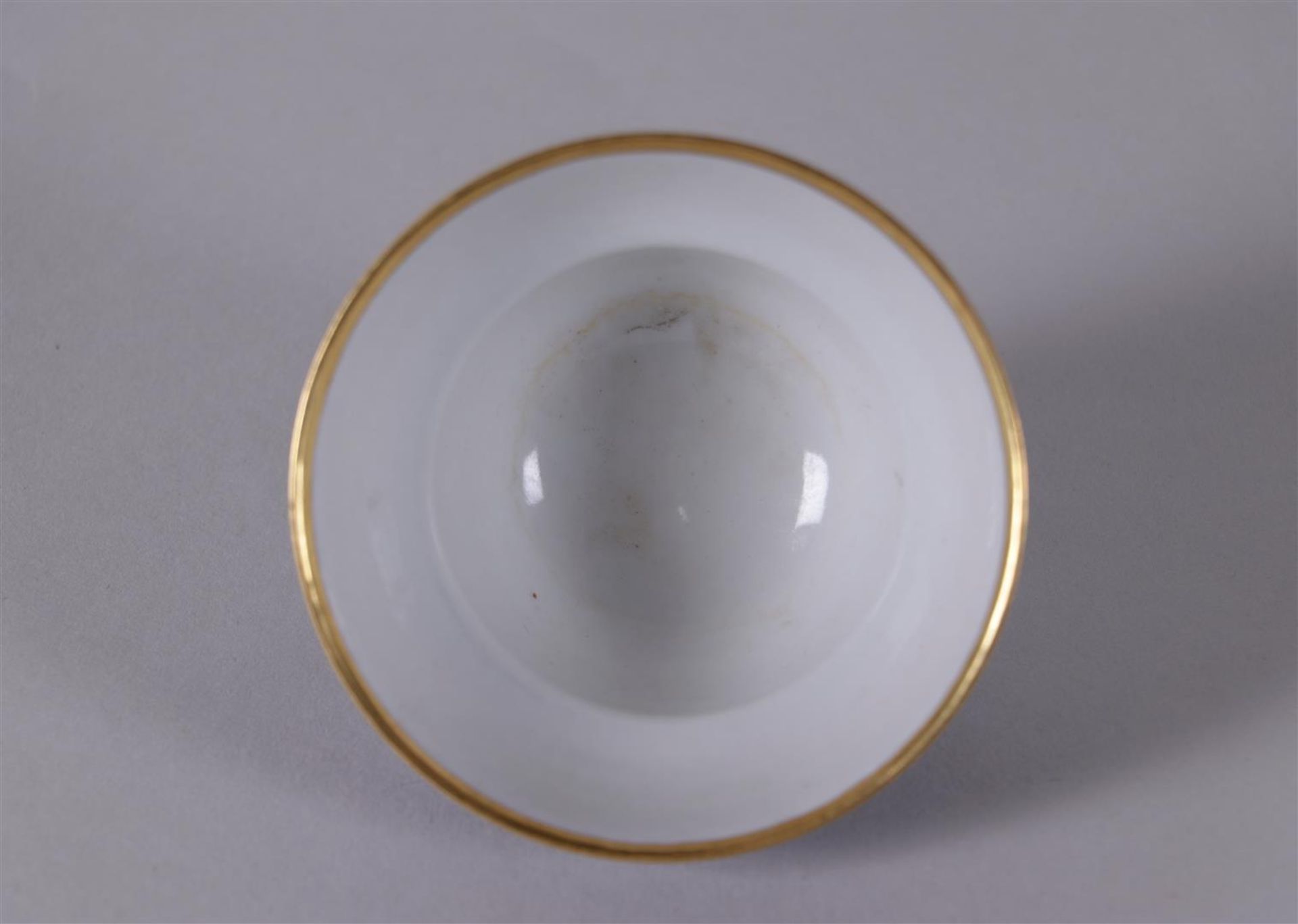 A porcelain blue and white bowl with gilt rim, marked in period. China, Daoguang.
Diam. 9 cm. - Image 2 of 4