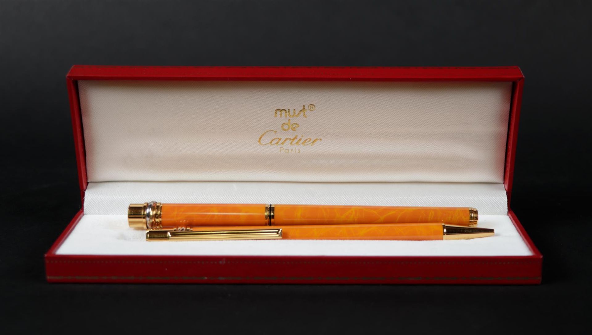 A Cartier pen set, Must de Cartier, consisting of a fountain pen and a ballpoint pen, in box and wit