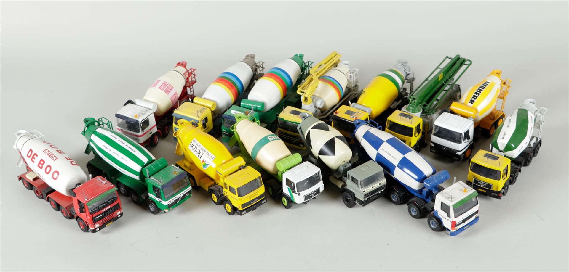 A large collection of trucks and trailers including CONRAD.