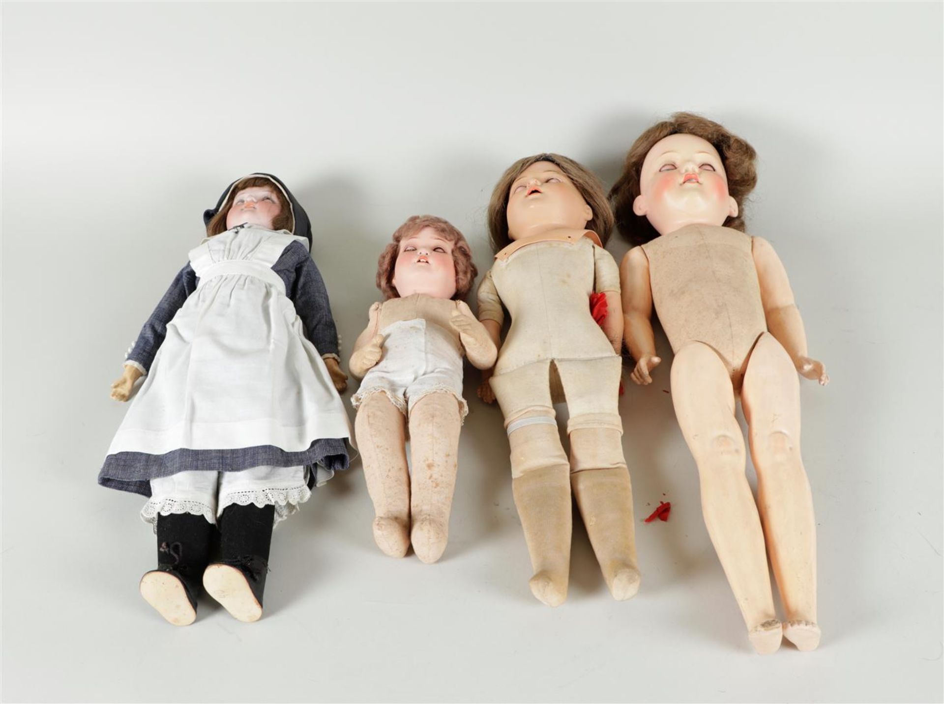 A lot consisting of (4) antique dolls including (1) turtle, (2x) Armand Marseille, and one unknown b