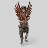 A polychrome wooden sculpture of Garuda, Indonesia, first half of the 20th century. Includes a carve