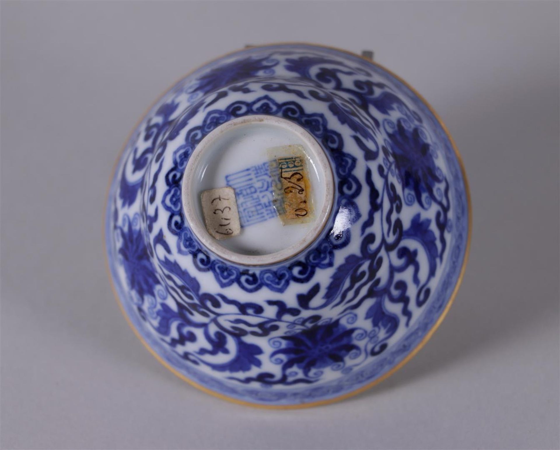A porcelain blue and white bowl with gilt rim, marked in period. China, Daoguang.
Diam. 9 cm. - Image 3 of 4