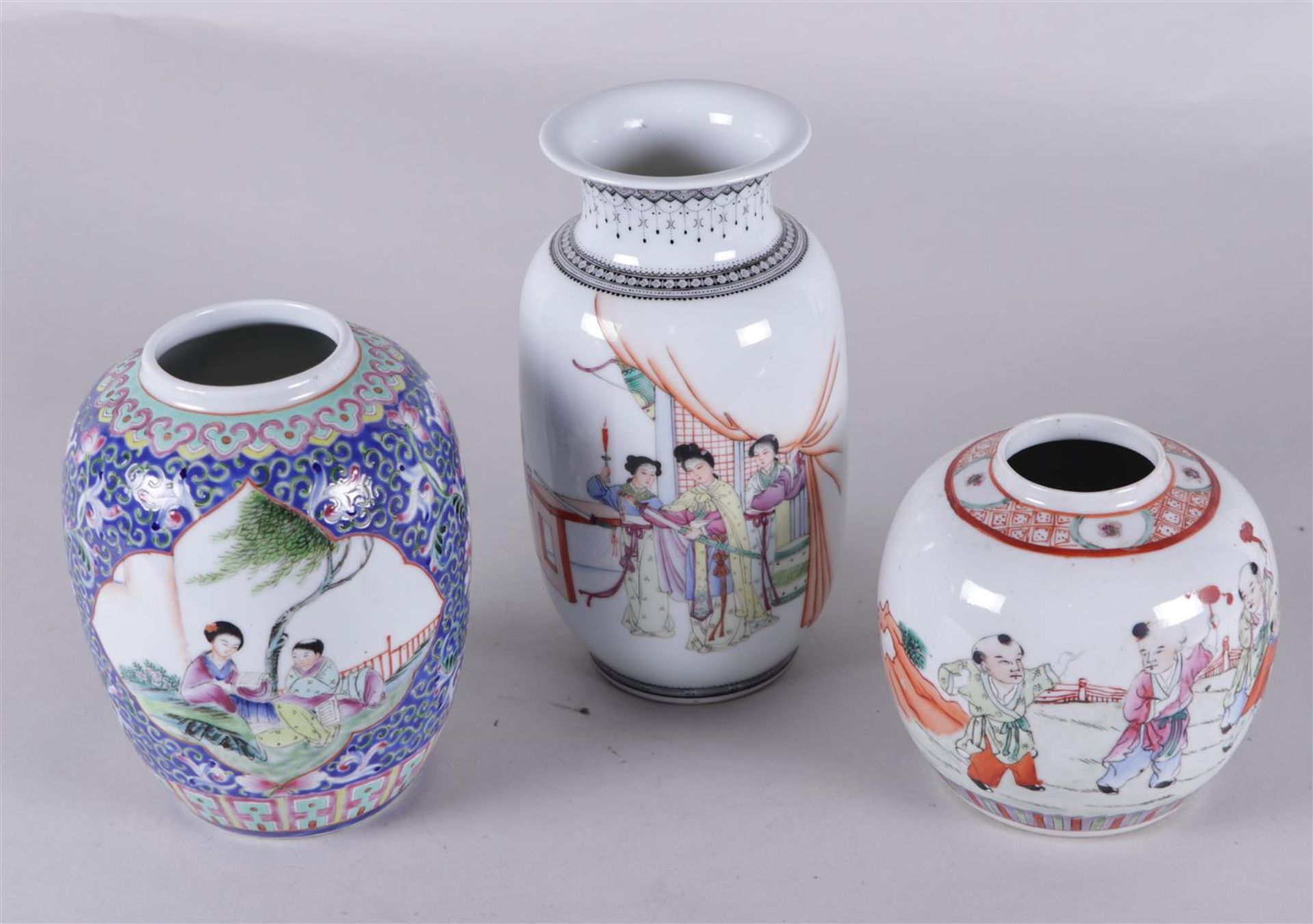 A lot of three porcelain famile rose vases/pots, decorated with various figures. China, Republic.