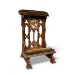 An oak Neo-Gothic prayer chair with centrally carved symbols for faith, hope and love (Fides, Spes e