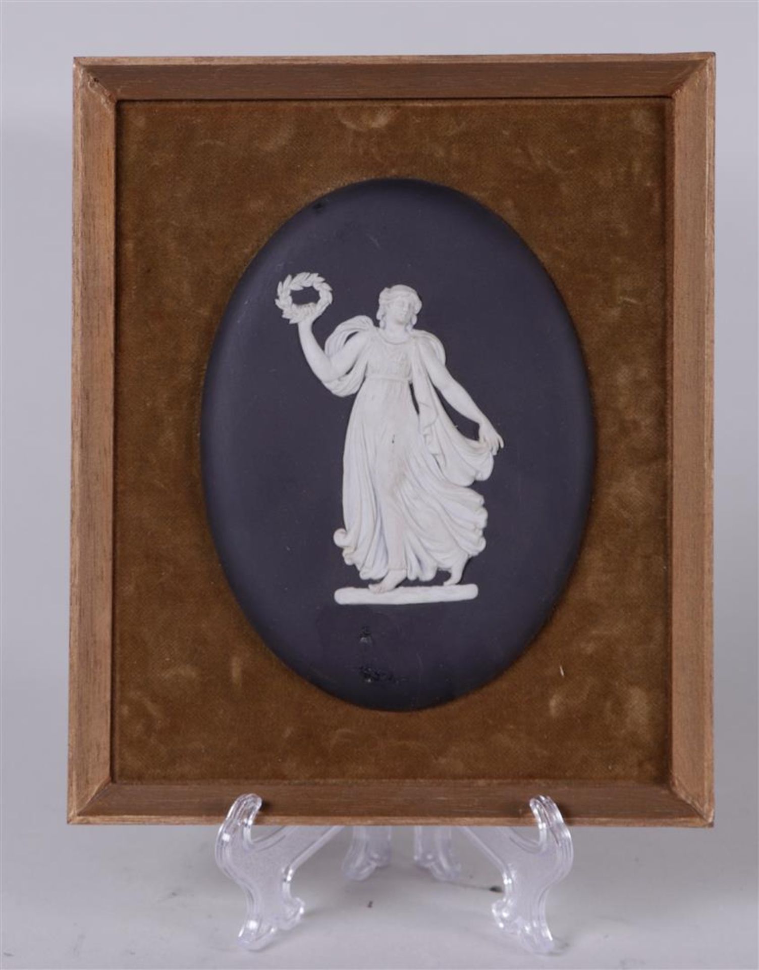 A 'jasperware' plaque depicting an allegorical figure with a laurel wreath. (eternal fame).
13 x 10 