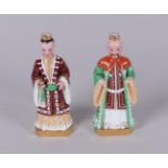 Two porcelain figures in costume, marked JP. Jacob Petit, 19th century.
H. 18 cm.