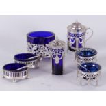 A lot consisting of (2) spice trays with matching spoon, both with blue glass inner containers. Mark