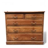 An English mahogany chest of drawers with three large and two small drawers, ca. 1900.