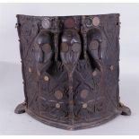 An Indonesian baby carrier, made of ironwood, origin: Nias, Borneo with family coat of arms on the i