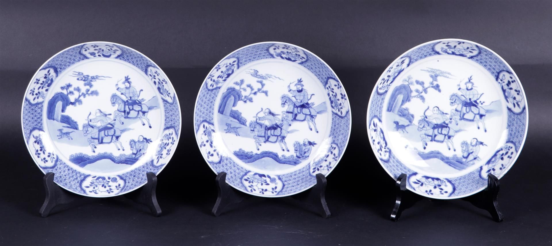 A set of three porcelain dishes 'Joosje on horseback', marked with a shell in a double circle. China