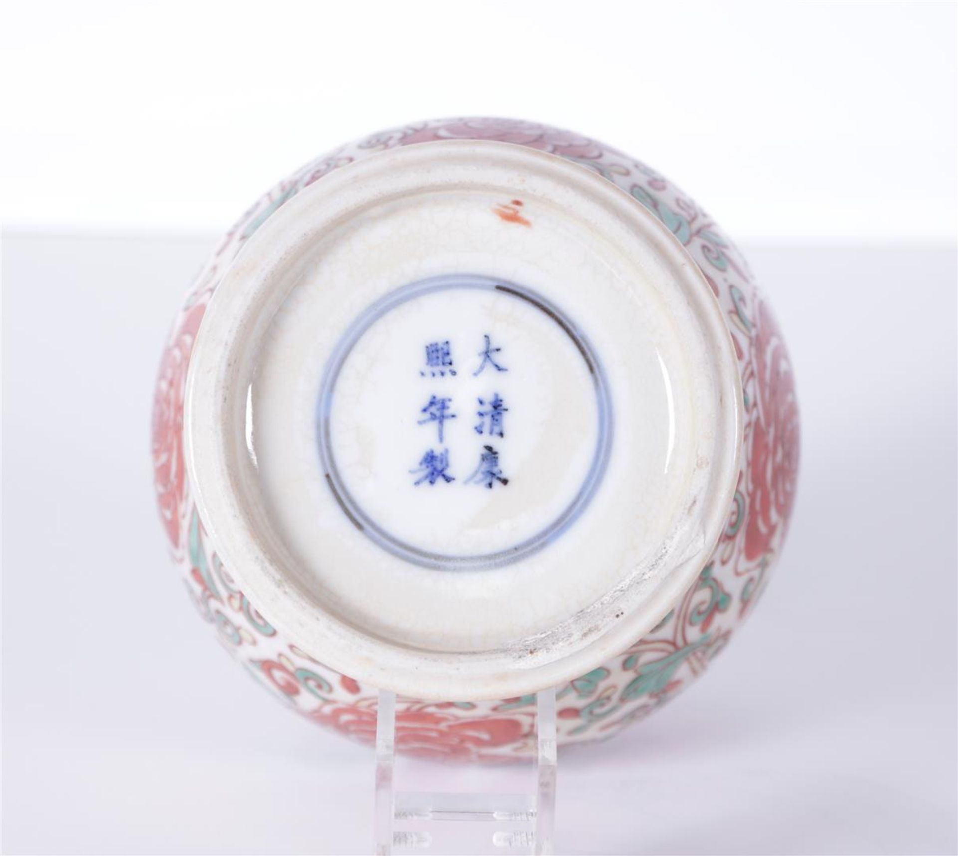 A porcelain lidded jar with floral decor, marked Kangxi. China, 19th century.
H. 25 cm. - Image 2 of 5